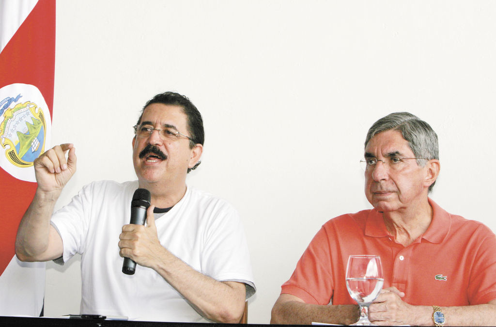 Hondura's President Manuel Zelaya, left, speaks as Costa Rica's President Oscar Arias looks on during a press conference at the Juan Santamaria International airport in San Jose, Sunday, June 28, 2009. Soldiers seized Honduras' national palace and sent Zelaya into exile in Costa Rica on Sunday, hours before a disputed constitutional referendum. Zelaya, a leftist ally of Venezuelan President Hugo Chavez, said he was victim of a coup. (AP Photo/Kent Gilbert)