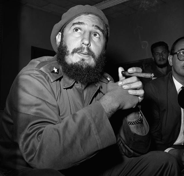 FILE - In this June 14, 1961 file photo, Prime Minister Fidel Castro holds a cigar during a news conference in Havana, Cuba. For over half a century, the U.S. government tried many schemes to overthrow the Castro regime: poisonous cigars, an exploding seashell, the secret Twitter-like service in Cuba. U.S. President Barack Obama said Wednesday, Dec. 17, 2014 the United States will re-establish diplomatic ties with Cuba and bring change to the longstanding trade embargo. But it was unclear if all secret operations would cease. (AP Photo/RHS)
