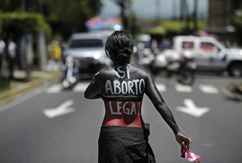 A woman participates in a march on the International Day of Action for the Decriminalization of Abortion, on September 28, 2012 in San Salvador. Salvadorean women marched to ask the government to legalize abortion as a right for women. AFP PHOTO/Jose CABEZAS